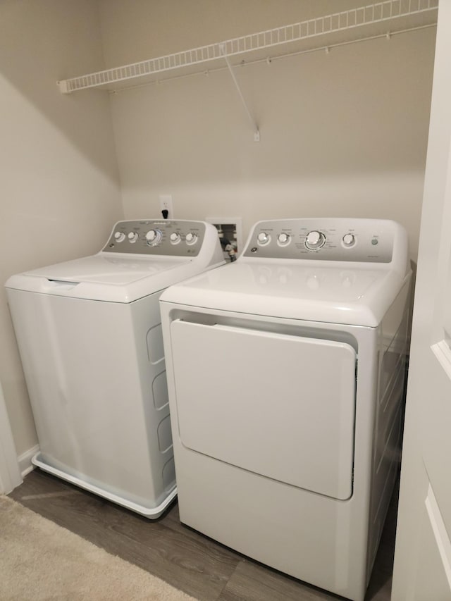 laundry area with separate washer and dryer