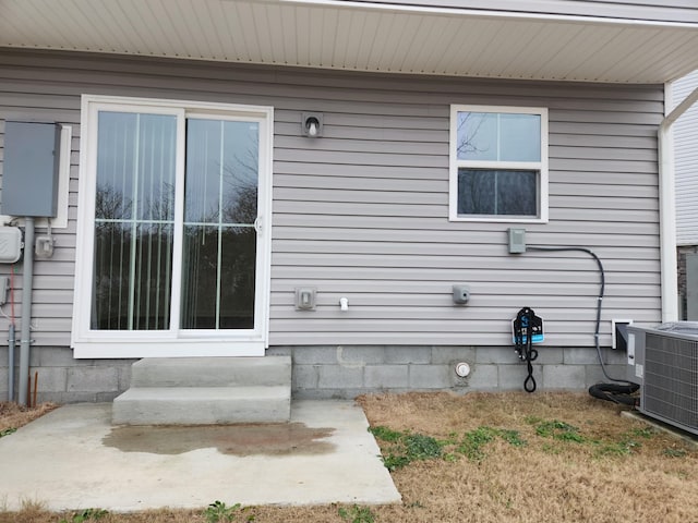 view of home's exterior with central AC unit