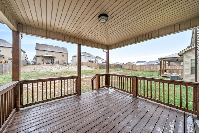 wooden terrace with a yard