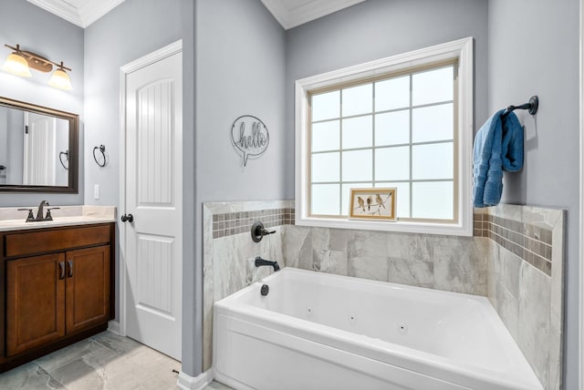 bathroom featuring vanity, ornamental molding, and a tub