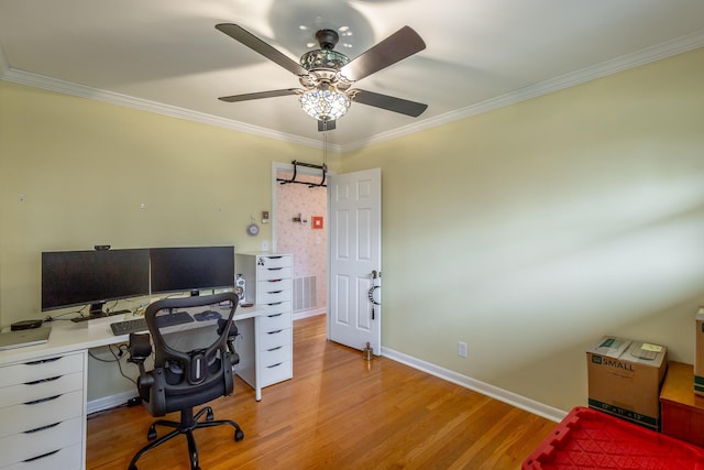 office with light wood-type flooring, ceiling fan, and crown molding