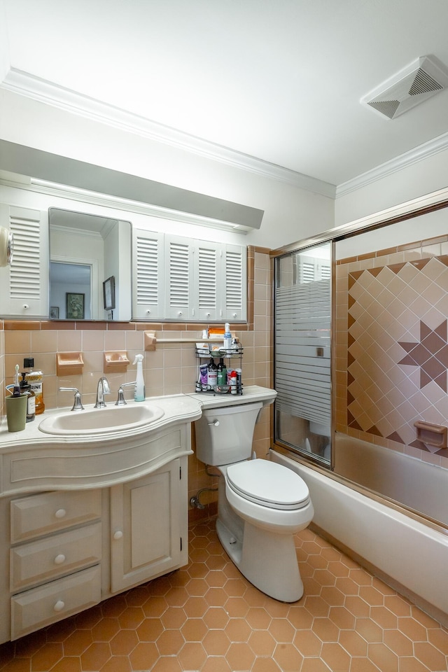 full bathroom featuring backsplash, tile patterned floors, vanity, shower / bath combination with glass door, and tile walls