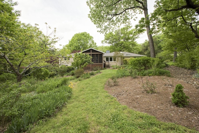 view of yard featuring a sunroom