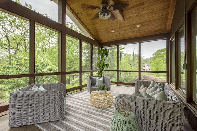 sunroom with ceiling fan, a healthy amount of sunlight, and wood ceiling