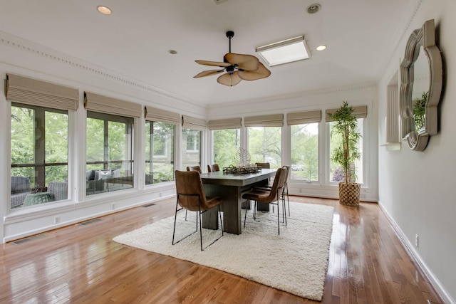 sunroom / solarium with ceiling fan