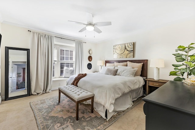 carpeted bedroom featuring ceiling fan, ornamental molding, and access to outside