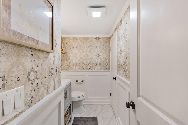 bathroom with toilet and ornamental molding