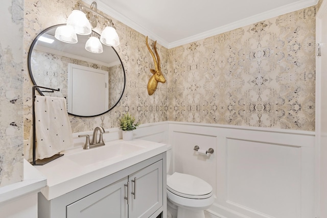 bathroom featuring vanity, toilet, and crown molding