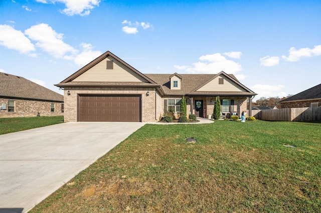 view of front of property with a garage and a front yard