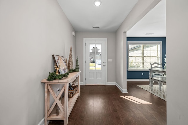 entryway with dark hardwood / wood-style floors