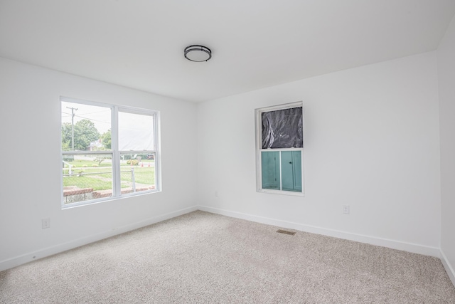 unfurnished room featuring carpet