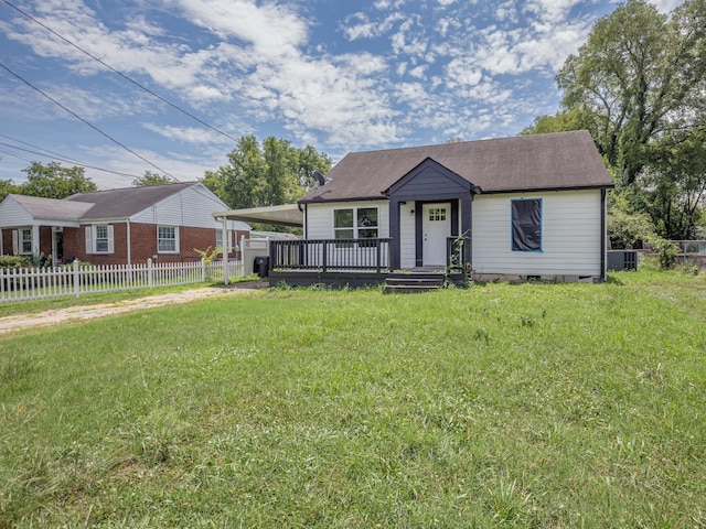 view of front of property featuring a carport and a front yard