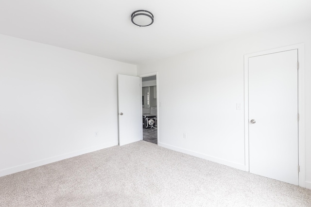 unfurnished room with carpet flooring