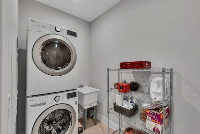 laundry room featuring stacked washing maching and dryer