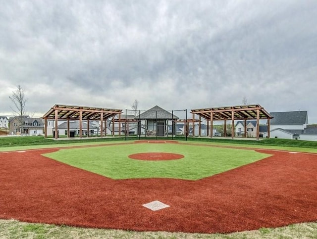 surrounding community featuring a lawn and a pergola