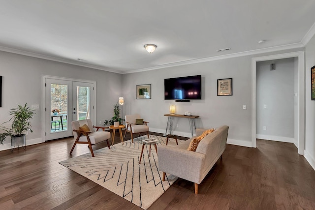 living room with french doors, dark hardwood / wood-style floors, and crown molding