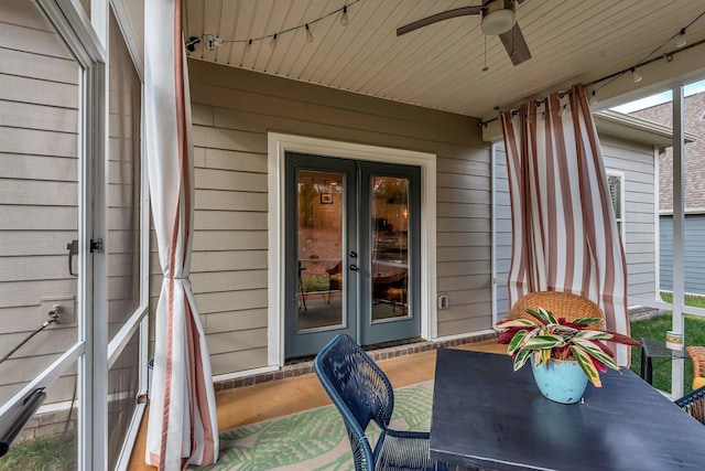 exterior space featuring ceiling fan and wooden ceiling