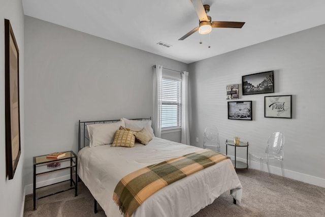 bedroom featuring ceiling fan and carpet