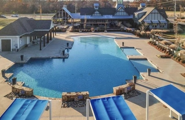 view of pool featuring a patio area