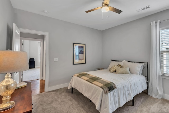 bedroom with ceiling fan and carpet