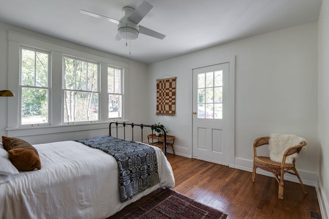 bedroom featuring ceiling fan and dark hardwood / wood-style flooring