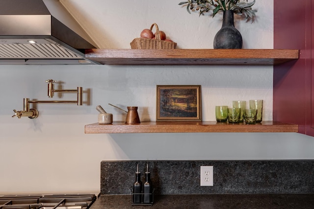 room details featuring wall chimney exhaust hood