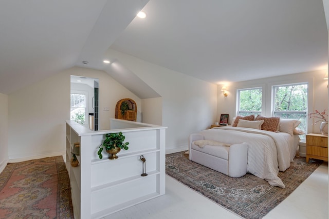 bedroom featuring lofted ceiling