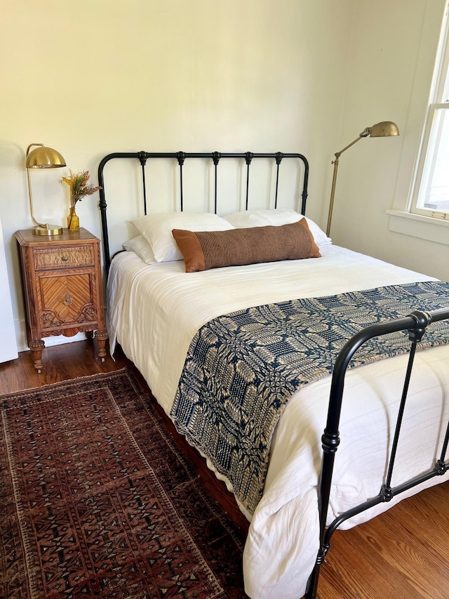 bedroom featuring dark hardwood / wood-style floors