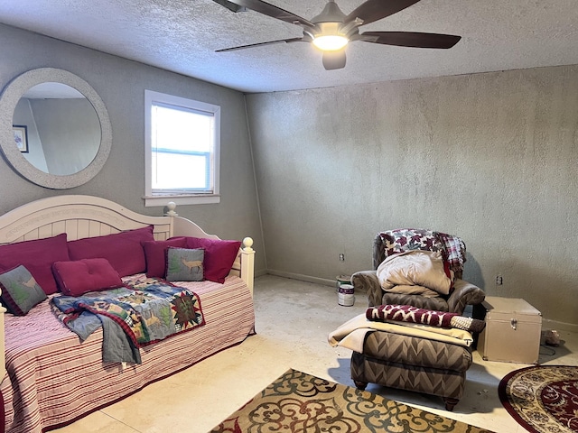 bedroom with ceiling fan and a textured ceiling