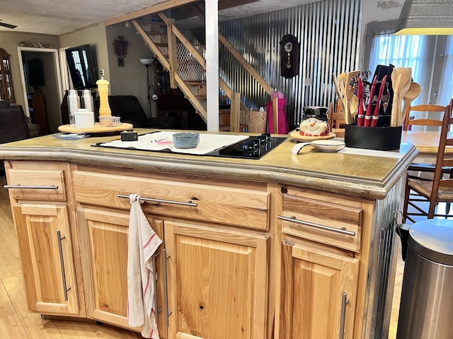 kitchen featuring gas stovetop and light hardwood / wood-style floors