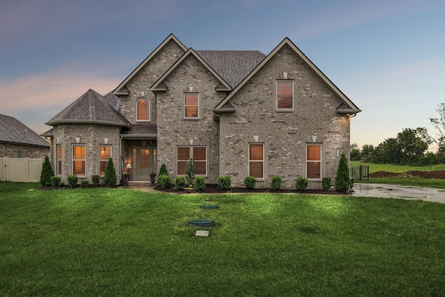 view of front of property with a yard