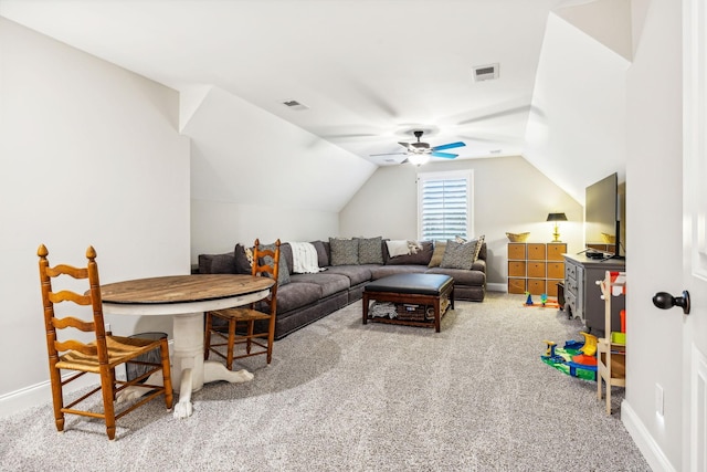 living room featuring ceiling fan, light colored carpet, and vaulted ceiling