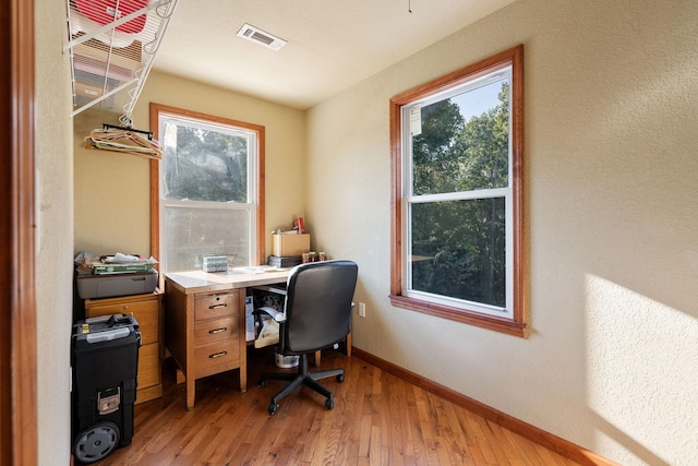 office area with hardwood / wood-style floors