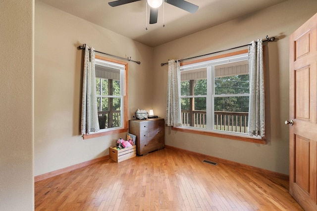 spare room featuring ceiling fan and light wood-type flooring