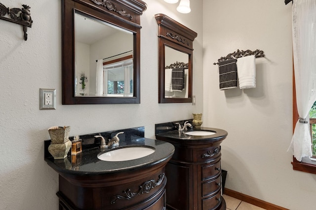 bathroom with tile patterned floors and vanity