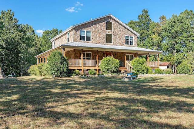 view of front of property with a porch and a front lawn