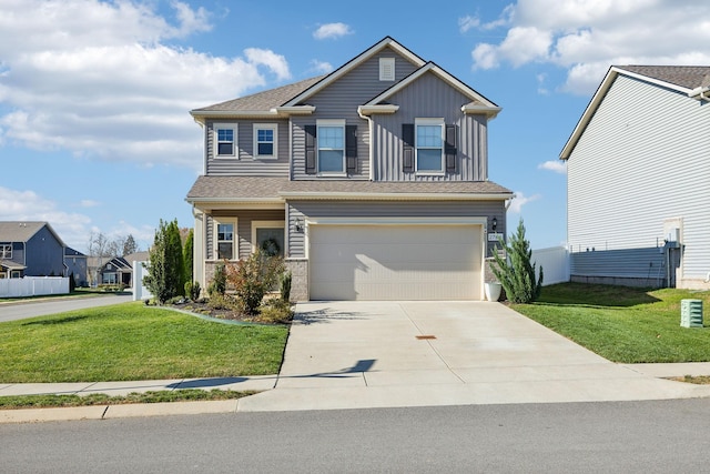 view of front of house featuring a front yard and a garage