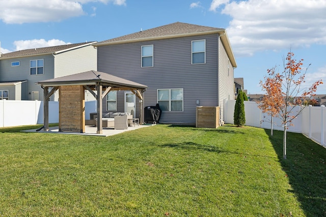 rear view of house with outdoor lounge area, a gazebo, a yard, and a patio