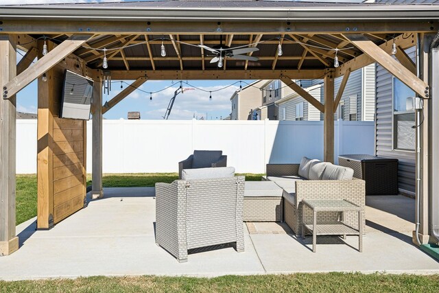 view of patio / terrace featuring a gazebo, ceiling fan, and outdoor lounge area