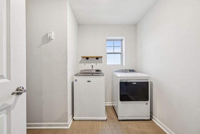 laundry room featuring washer and clothes dryer