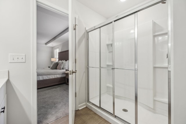 bathroom with vanity and a shower with shower door