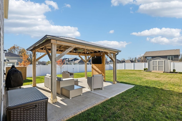 view of patio featuring a gazebo, an outdoor living space, and a storage unit