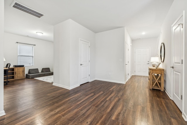 empty room featuring dark hardwood / wood-style flooring