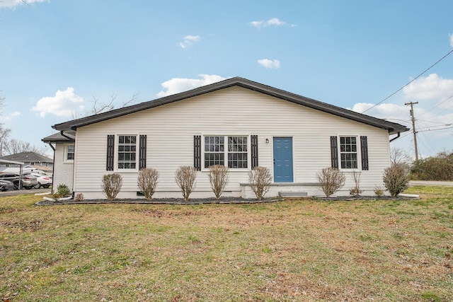 view of property exterior with a yard