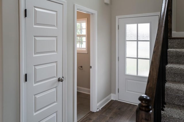 doorway with dark hardwood / wood-style floors