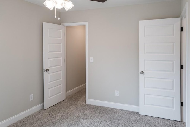 unfurnished bedroom featuring light colored carpet