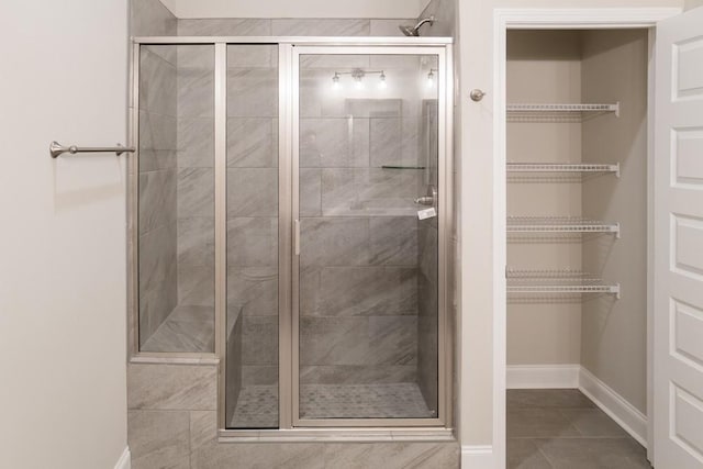 bathroom featuring tile patterned floors and an enclosed shower