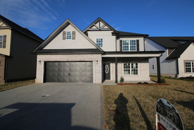 view of front of home featuring a garage and a front lawn