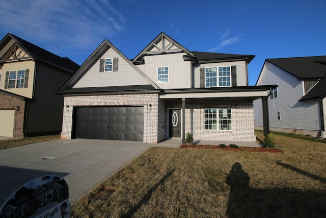 craftsman house with a front yard and a garage