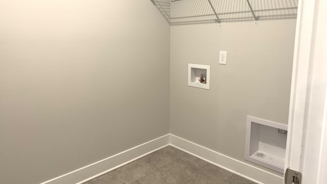 washroom featuring tile patterned floors and hookup for a washing machine